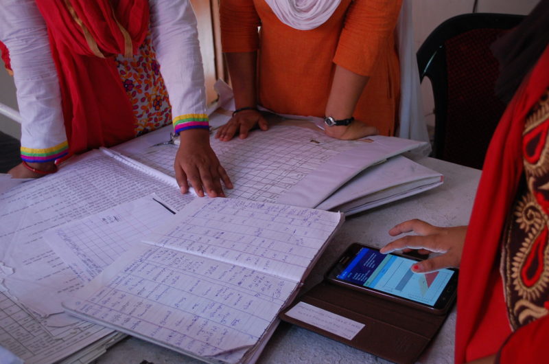 Supervisors use a mobile data collection app to review the performance of a team of community health workers