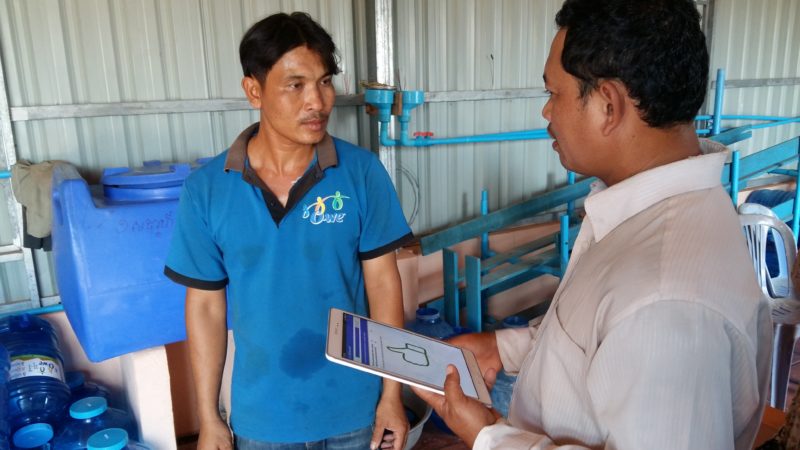 A supervisor provides feedback to a frontline worker