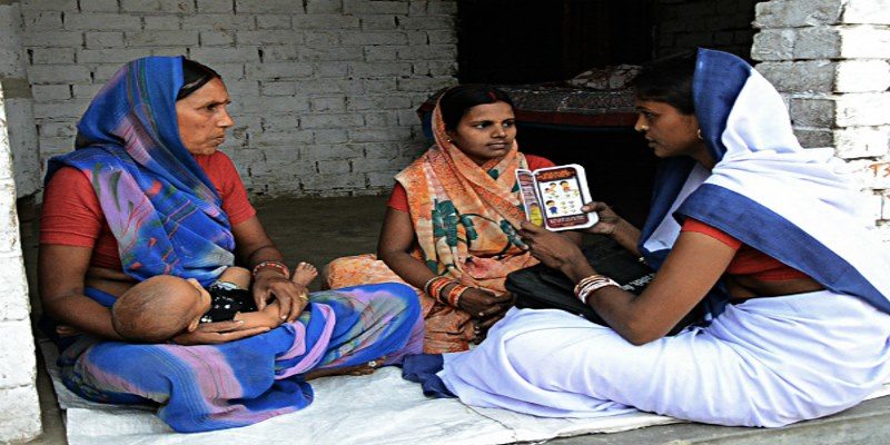 An Anganwadi Worker administering ICDS-CAS in the Field