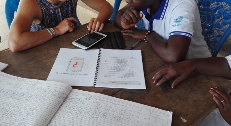 Community health workers review their mobile data collection app together for potential bias in the questions